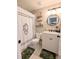 Charming bathroom with decorative shower curtain, shelving, and white vanity at 1581 Shetland Pony Ct, Suwanee, GA 30024