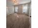 Bedroom with plush carpeting and neutral walls with light pouring in through the curtains at 1581 Shetland Pony Ct, Suwanee, GA 30024