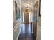 Inviting entryway with hardwood floors, decorative wall accents, and modern lighting at 1581 Shetland Pony Ct, Suwanee, GA 30024