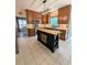 Well-equipped kitchen featuring an island, stainless steel appliances, and ample cabinetry at 1581 Shetland Pony Ct, Suwanee, GA 30024