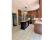 Open kitchen with a center island, stainless steel appliances, and views to the living area at 1581 Shetland Pony Ct, Suwanee, GA 30024