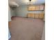 Large living room with neutral carpet, built-in cabinets, and modern track lighting at 1581 Shetland Pony Ct, Suwanee, GA 30024