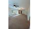 Spacious living room with a ceiling fan, recessed lighting, and doors leading to a deck at 1581 Shetland Pony Ct, Suwanee, GA 30024