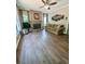 Spacious living room featuring a fireplace, ceiling fan, and attractive wood-look flooring at 1581 Shetland Pony Ct, Suwanee, GA 30024