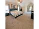 Large main bedroom with a ceiling fan, carpeted floors, and plenty of natural light at 1581 Shetland Pony Ct, Suwanee, GA 30024