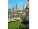 Balcony with a hanging chair and views of the Atlanta skyline at 285 Centennial Olympic Park Nw Dr # 1905, Atlanta, GA 30339