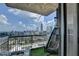 Spacious balcony with a skyline view, a hanging chair, and modern seating arrangement at 285 Centennial Olympic Park Nw Dr # 1905, Atlanta, GA 30339