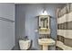 Charming bathroom features a classic pedestal sink and a stylish striped shower curtain, creating a cozy atmosphere at 285 Centennial Olympic Park Nw Dr # 1905, Atlanta, GA 30339