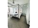 Bright bedroom features a modern canopy bed and ample natural light at 285 Centennial Olympic Park Nw Dr # 1905, Atlanta, GA 30339