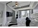 Modern bedroom with canopy bed, desk, and large window offering natural light and city views at 285 Centennial Olympic Park Nw Dr # 1905, Atlanta, GA 30339