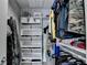 Organized walk-in closet featuring custom shelving for optimal storage and display of clothing and accessories at 285 Centennial Olympic Park Nw Dr # 1905, Atlanta, GA 30339