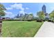 Landscaped community green space offers benches, walkways, trees and skyline views at 285 Centennial Olympic Park Nw Dr # 1905, Atlanta, GA 30339
