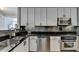 A kitchen with stainless steel appliances, a granite countertop, and modern cabinetry at 285 Centennial Olympic Park Nw Dr # 1905, Atlanta, GA 30339
