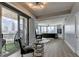 Bright living room featuring a balcony with city views, modern lighting, and hard wood floors at 285 Centennial Olympic Park Nw Dr # 1905, Atlanta, GA 30339