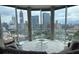 Modern living room featuring floor-to-ceiling windows showcasing city skyline views at 285 Centennial Olympic Park Nw Dr # 1905, Atlanta, GA 30339