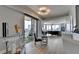 Modern living room with floor-to-ceiling windows and a balcony with city views at 285 Centennial Olympic Park Nw Dr # 1905, Atlanta, GA 30339