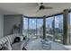 Bright living room featuring large windows with city views, modern decor, and a cozy seating area at 285 Centennial Olympic Park Nw Dr # 1905, Atlanta, GA 30339