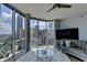Bright living room featuring large windows with city views, modern decor, and a cozy seating area at 285 Centennial Olympic Park Nw Dr # 1905, Atlanta, GA 30339
