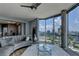 Bright living room featuring large windows with city views, modern decor, and a cozy seating area at 285 Centennial Olympic Park Nw Dr # 1905, Atlanta, GA 30339