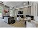 Modern lounge area featuring comfortable seating, a large TV, and stylish decor at 285 Centennial Olympic Park Nw Dr # 1905, Atlanta, GA 30339