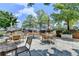 Outdoor patio with tables, chairs, grills, greenery and city views at 285 Centennial Olympic Park Nw Dr # 1905, Atlanta, GA 30339