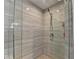 Contemporary shower with sleek glass enclosure and stylish tile work, designed for a modern aesthetic at 285 Centennial Olympic Park Nw Dr # 1905, Atlanta, GA 30339