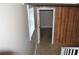 View of finished basement featuring tiled floor, wood paneling, and a window at 3293 Oakcliff Rd, Doraville, GA 30340