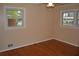 Bedroom featuring hardwood floors, neutral paint, and natural light from windows at 3293 Oakcliff Rd, Doraville, GA 30340