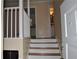 Home entryway leading to upper staircase, kitchen and bathroom with white trim at 3293 Oakcliff Rd, Doraville, GA 30340