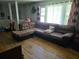 Open-concept living room with hardwood floors and large sectional at 3293 Oakcliff Rd, Doraville, GA 30340
