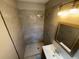 Bathroom featuring newly tiled shower, modern fixtures, and vanity at 420 Creekview Ct, Marietta, GA 30064