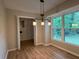 Dining Area featuring modern lighting fixtures, hardwood floors, a window and closet space at 420 Creekview Ct, Marietta, GA 30064