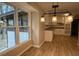 Dining Area featuring modern lighting fixtures and hardwood floors overlooking the kitchen at 420 Creekview Ct, Marietta, GA 30064