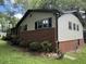 Side exterior featuring brick, siding, and black shutters at 420 Creekview Ct, Marietta, GA 30064