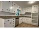Bright kitchen featuring white cabinets, granite countertops, and stainless steel appliances at 420 Creekview Ct, Marietta, GA 30064