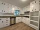 Bright kitchen featuring white cabinets, granite countertops, and stainless steel appliances at 420 Creekview Ct, Marietta, GA 30064