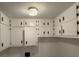 Laundry room with white paneled walls and white cabinets at 420 Creekview Ct, Marietta, GA 30064