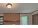 Cozy living room features a brick fireplace and adjacent doorway at 420 Creekview Ct, Marietta, GA 30064