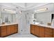 Elegant bathroom with double vanities and a glass-enclosed shower at 575 Valley Hall Dr, Sandy Springs, GA 30350