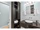 Contemporary bathroom with a white basin sink and a black storage cabinet at 575 Valley Hall Dr, Sandy Springs, GA 30350