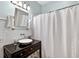 Bathroom features a vessel sink, storage vanity, and shower with a curtain at 575 Valley Hall Dr, Sandy Springs, GA 30350