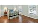 This stylish bedroom boasts natural light, hardwood floors, and accent tables with lamps at 575 Valley Hall Dr, Sandy Springs, GA 30350