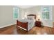 Comfortable bedroom with hardwood floors, natural light, and classic decor at 575 Valley Hall Dr, Sandy Springs, GA 30350
