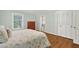 This bedroom boasts a bed, chest of drawers, closet, and an attached bathroom at 575 Valley Hall Dr, Sandy Springs, GA 30350
