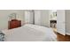 Bright bedroom featuring wood floors and a view into the attached bathroom and hallway at 575 Valley Hall Dr, Sandy Springs, GA 30350
