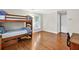 This bedroom boasts wood bunkbeds, light gray walls, and a window with natural light at 575 Valley Hall Dr, Sandy Springs, GA 30350
