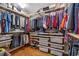 Organized walk-in closet with ample storage and custom shelving at 575 Valley Hall Dr, Sandy Springs, GA 30350