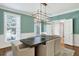Dining room with natural light, modern chandelier and hardwood floors at 575 Valley Hall Dr, Sandy Springs, GA 30350