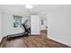 The home exercise room features a treadmill, wood floors, and natural light at 575 Valley Hall Dr, Sandy Springs, GA 30350