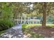 Wonderful home exterior view shows classic architecture and mature trees at 575 Valley Hall Dr, Sandy Springs, GA 30350